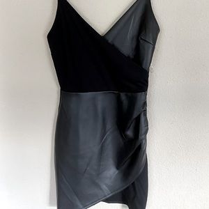 Faux leather, mixed material mini dress. Never worn.